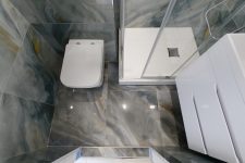Выполненный ремонт в санузле 180x150 с перепланировкой, замена ванны на душ/угол